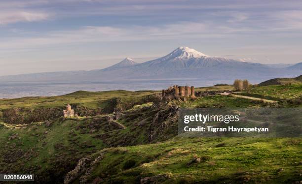 armenia, amberd fortress and vahramashen church in the background of the mt. ararat. - armenian church stock pictures, royalty-free photos & images