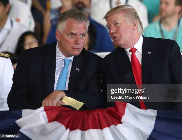 President Donald Trump , talks with Virginia Governor Terry McAuliffe during the commissioning of the USS Gerald R. Ford CVN 78, on July 22, 2017 in...