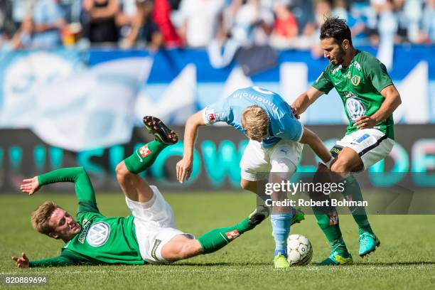 Jesper Svensson of Jonkopings Sodra and Anton Tinnerholm of Malmo FF and Andre Calisir of Jonkopings Sodra during the Allsvenskan match between Malmo...