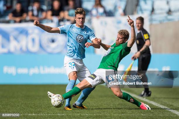 Mattias Svanberg of Malmo FF and Stefan Karlsson of Jonkopings Sodra during the Allsvenskan match between Malmo FF and Jonkopings Sodra IF at...