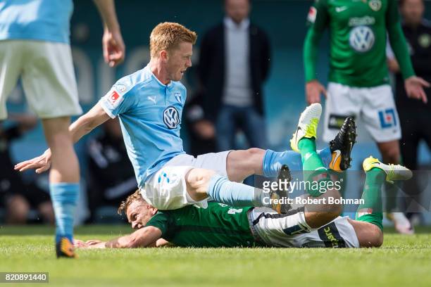 Stian Aasmundsen of Jonkopings Sodra and Anders Christiansen of Malmo FF during the Allsvenskan match between Malmo FF and Jonkopings Sodra IF at...