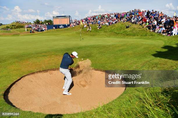 Brooks Koepka of the United States hits a bunker shot on the 7th hole during the third round of the 146th Open Championship at Royal Birkdale on July...