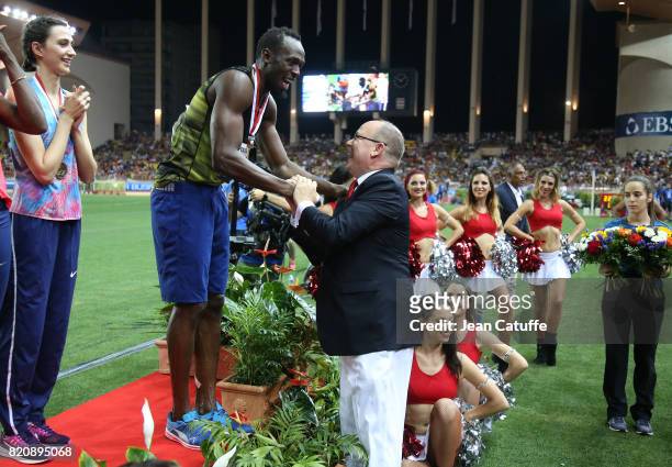 Prince Albert II of Monaco greets Usain Bolt of Jamaica after his victory in his last 100m in a meeting during the IAAF Diamond League Meeting...