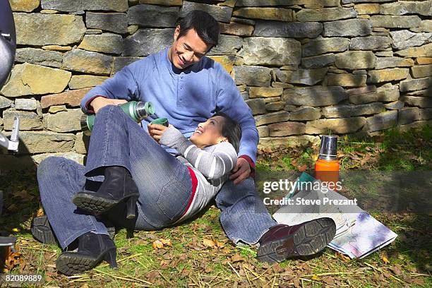 couple relaxing outdoors - steve prezant stock pictures, royalty-free photos & images