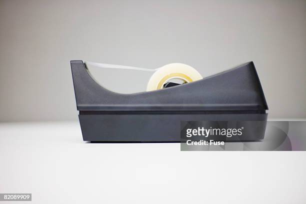 tape dispenser - tape dispenser stock pictures, royalty-free photos & images