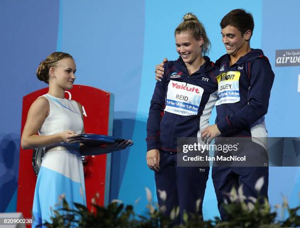 Tom Daley and Grace Reid of Great Britain are presented with their silver medals from the Mixed 3m Synchro Springboard during day nine of the FINA...