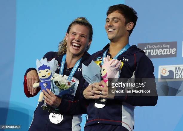 Tom Daley and Grace Reid of Great Britain pose with their silver medals from the Mixed 3m Synchro Springboard during day nine of the FINA World...