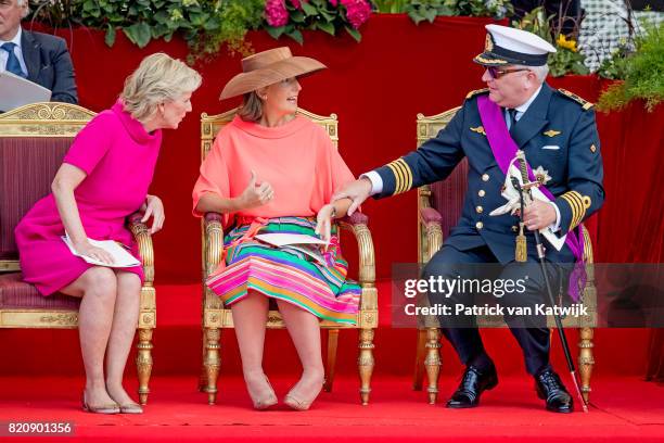 Princess Astrid of Belgium, Prince Laurent of Belgium and Princess Claire of Belgium attend the military parade on the occasion of the Belgian...