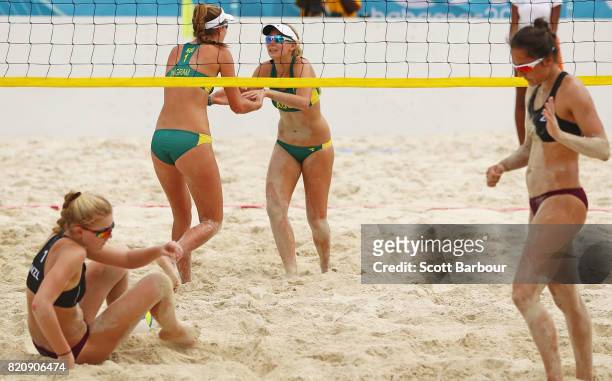 Rebecca Ingram and Carrie Van Rensburg of Australia celebrate during the girl's beach volleyball gold medal medal final match between Rebecca Ingram...