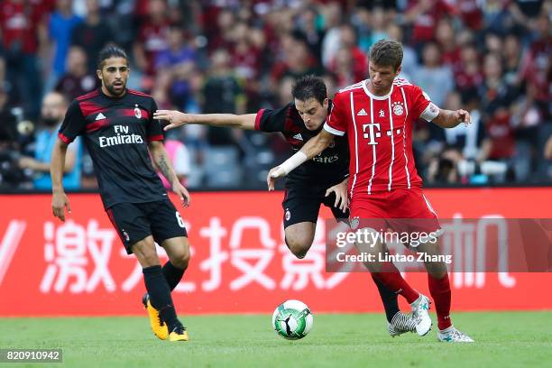 Thomas Mueller of FC Bayern competes for the ball with Giacomo Bonaventura of AC Milan during the 2017 International Champions Cup China match...