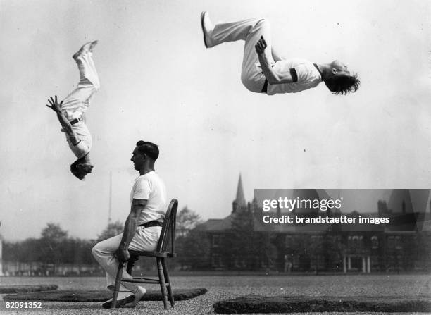 Acrobats at the somersault training, Photograph, May 10th 1934 [Akrobaten beim Salto-Training, Photographie Mai 1934]