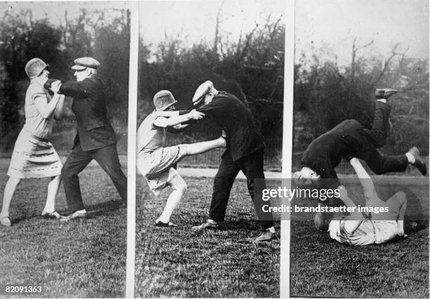 The english sports-woman Dot Butler and the german wrestling champion Peter Goetz demonstrating simple forms of self-defense, Photograph, Around 1930...