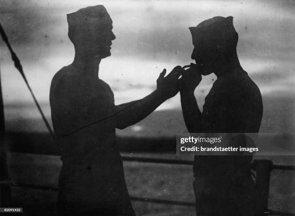 Silhouettes of two smoking marine soldiers, Photograph, Philipines, Around 1930