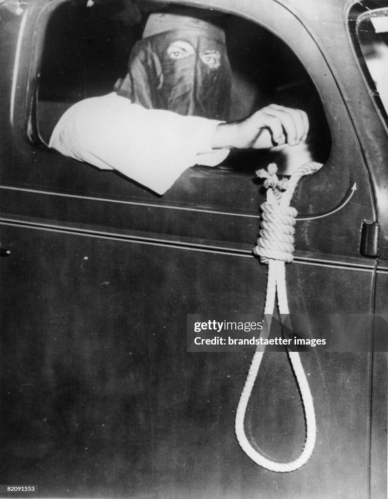 Member of the Ku Klux Klan with a noose, 75 cars of the Ku Klux Klan were driving through Miami, Florida to hold off black people form the election, Photograph, May 11th 1939