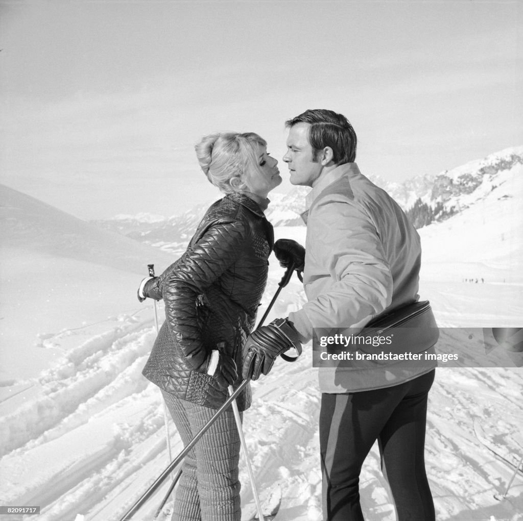 Toni Sailer and Vivi Bach in the television series "Luftspruenge im Schnee", Photography by Leo Hajek, 1969