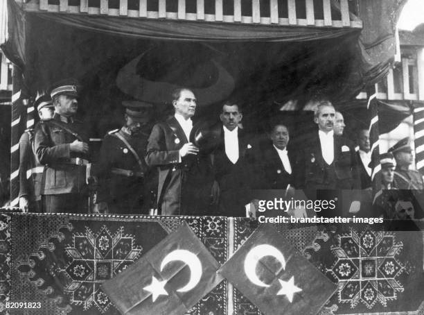 Mustafa Kemal Atatürk , founder and President of the Turkish Republic, watching a parade, circa 1929.