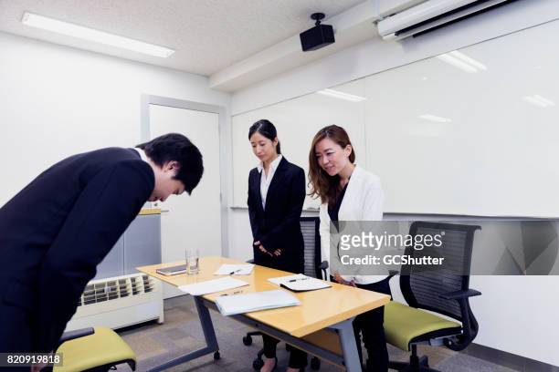 potential employee respectfully bowing - japanese respect stock pictures, royalty-free photos & images
