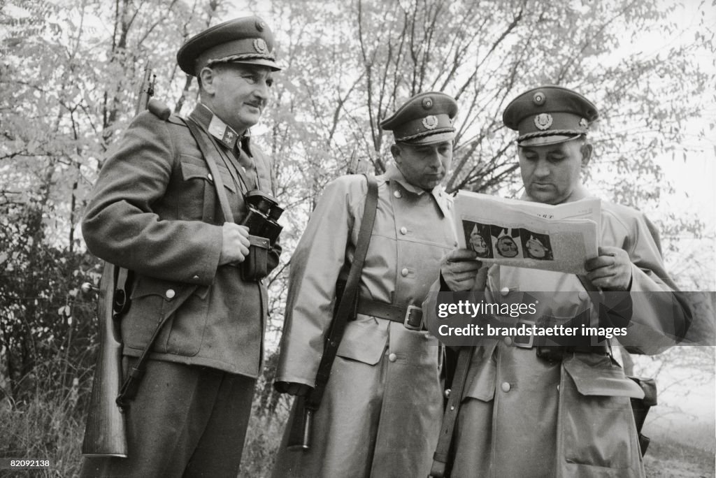 Hungarian Revolution: Gendarmes awaiting refugees at the Hungarian border, Austria, Photograph, 1956