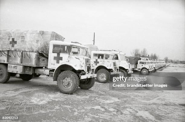 Hungarian Revolution: Trucks with aid supplies are waiting for the tripp to Hungary, Austria, Photograph, 1956 [Ungarische Revolution: Lastwagen mit...