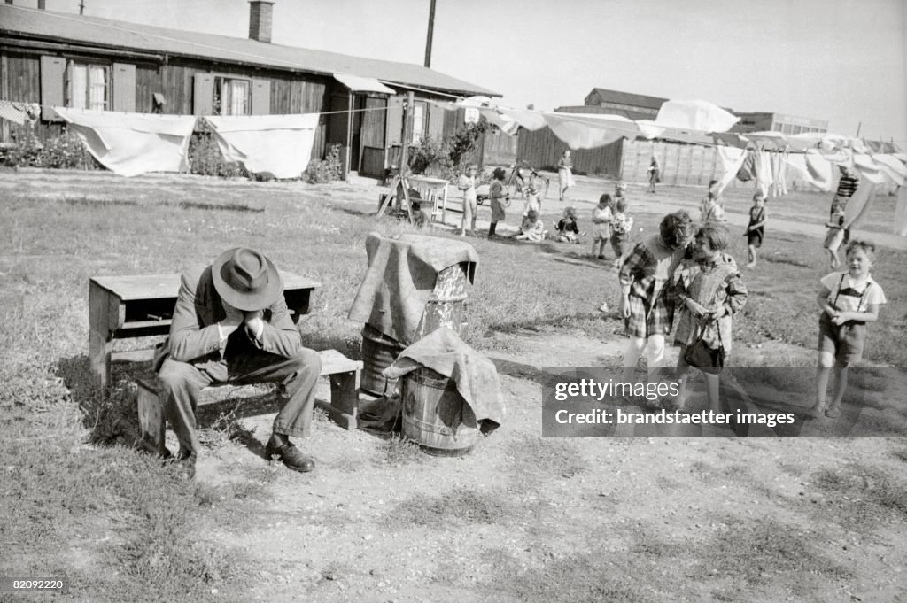 Hungarian Revolution: Desperate man in a refugee camp, Austria, Photograph, 1956
