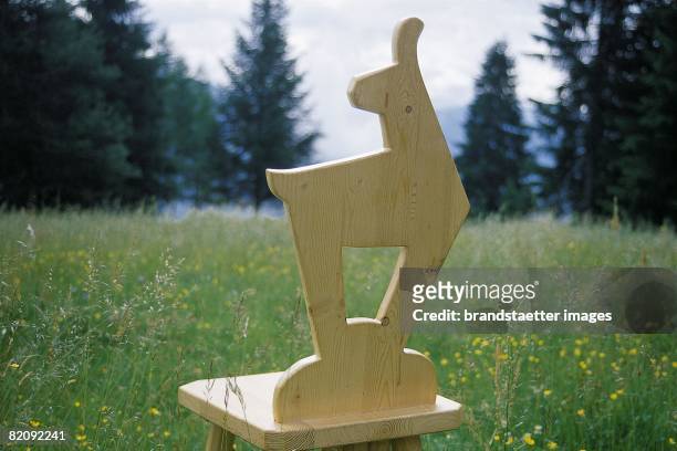 Chair with backrest in form of a chamois in Kitzbuehel, Tyrol, Photograph, Austria, Around 2000 [Sessel mit R?ckenlehne in Gamsform in Kitzb?hel,...