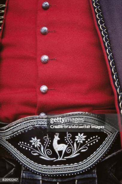 Belly belt with a stitchery of a chamois, Part of a typical traditional livery of Kitzbuehel, Photograph, Around 2000 [Leibbind mit einer Stickerei...