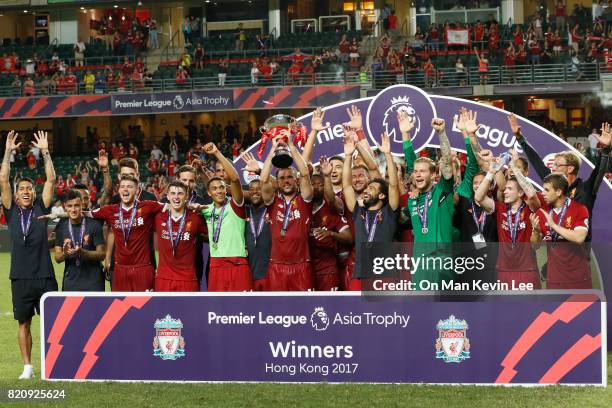 Players of the Liverpool FC celebrate with their trophy after the Premier League Asia Trophy final match between Leicester City FC and Liverpool FC...