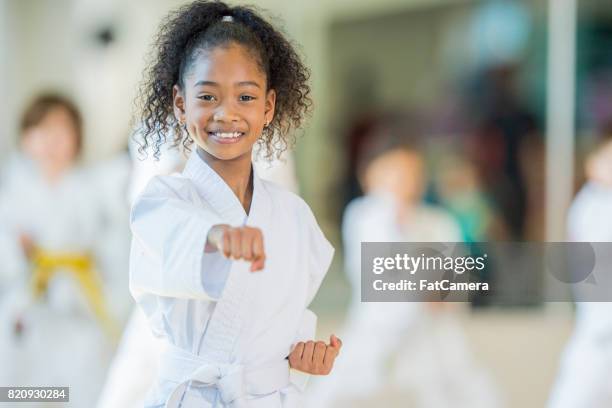taekwondo student - black martial art uniform stock pictures, royalty-free photos & images
