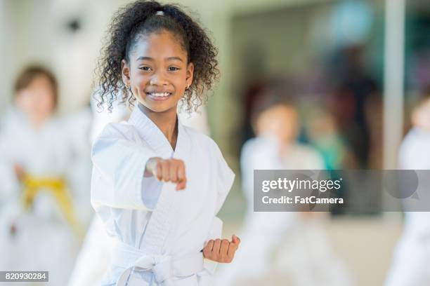 taekwondo student - girl punching stock pictures, royalty-free photos & images