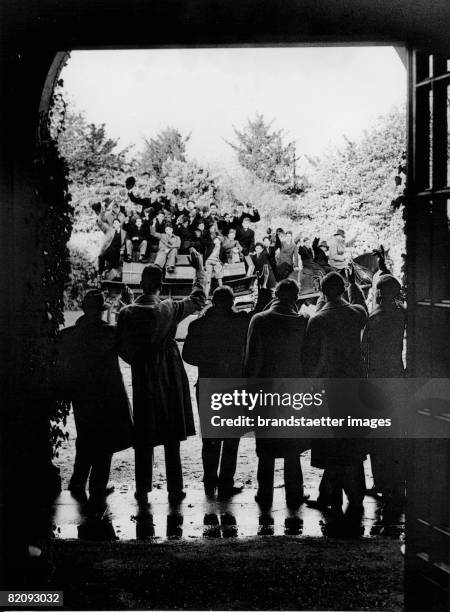 Schoolboys from Maiden Erleigh School leaving for the Christmas holidays, They are being transported by a carriage to the station, Photograph,...