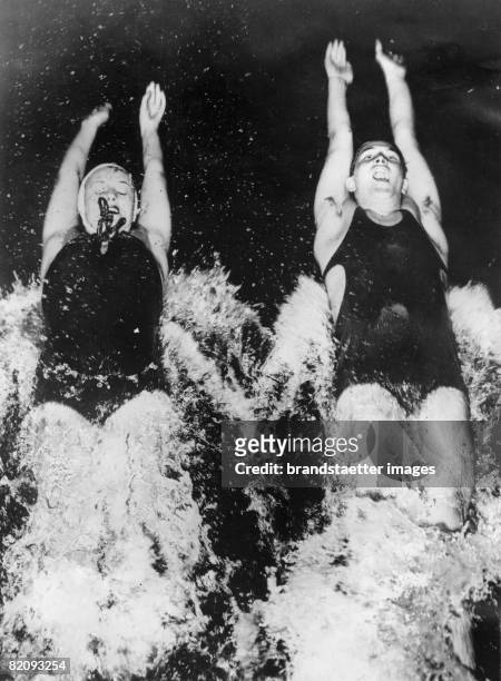 The tow backstroking world-champions Eleanora Holm Jarret und Adolph Kiefer training at the Athletic Club Chicago for the olympic games in Berlin...