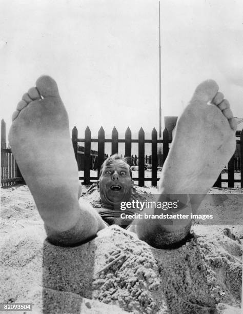 Portrait of the actor Karl Dane, Photograph, America, California, Around 1930 [Die Perspektive der Kamera l??t die F??e von Schauspieler Karl Dane...