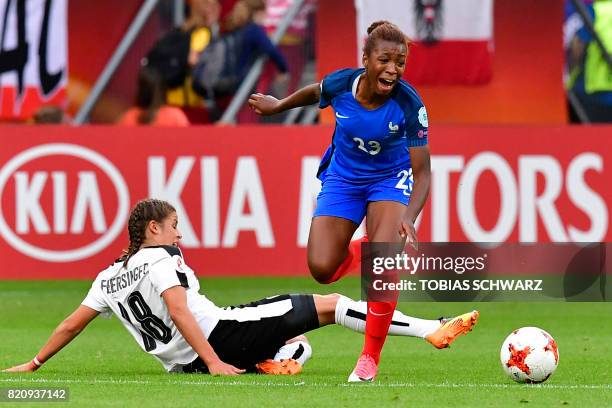 Austria's midfielder Laura Feiersinger tackles France's midfielder Onema Grace Geyoro during the UEFA Women's Euro 2017 football tournament between...