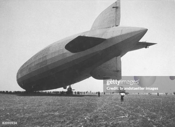 Airship "Count Zeppelin" landing at the Aspern Airfield near Vienna, Austria, A big crowd is watching, Photograph, 1931 [Das Luftschiff "Graf...