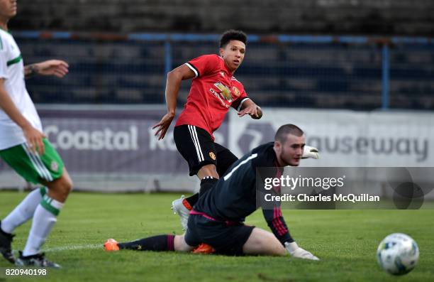 Nishan Burkart of Manchester United sees his shot saved Connor Larkin of Northern Ireland during the NI Super Cup game between Manchester United u18s...