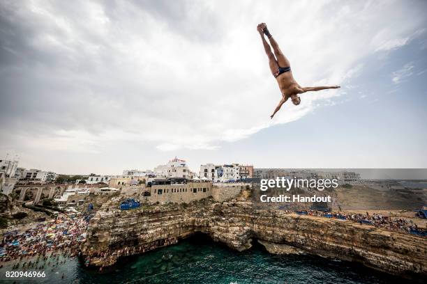 In this handout image provided by Red Bull, Orlando Duque of Colombia dives from the 27 metre platform during the first competition day of the third...