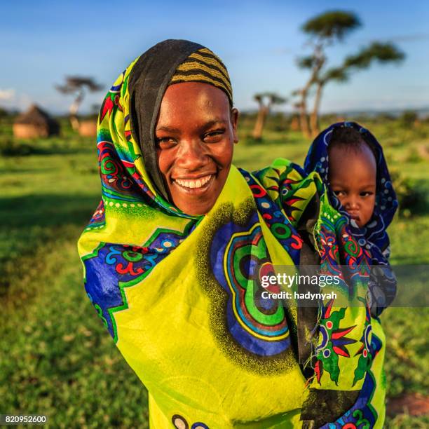 woman from borana tribe holding her baby, ethiopia, africa - borana stock pictures, royalty-free photos & images