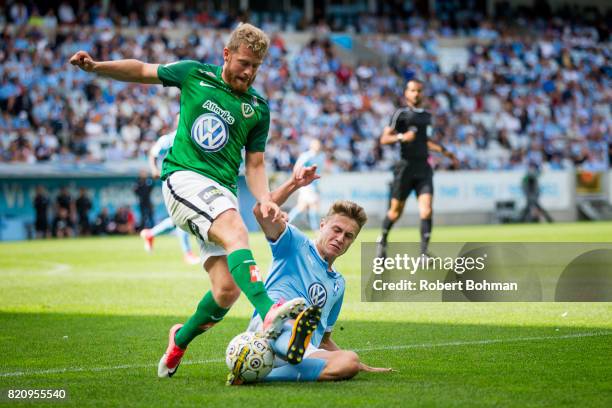 Stefan Karlsson of Jonkopings Sodra and Mattias Svanberg of Malmo FF during the Allsvenskan match between Malmo FF and Jonkopings Sodra IF at...