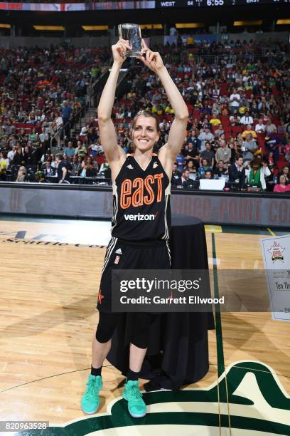 Allie Quigley of the Eastern Conference All-Stars holds up the trophy after winning the three-point contest as part of the Verizon WNBA All-Star Game...