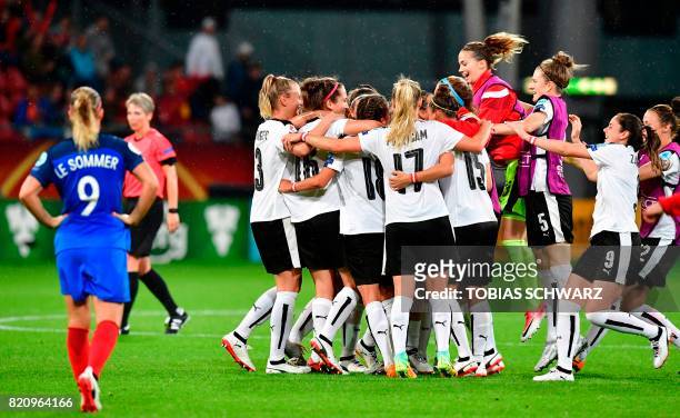 Austria's team players celebrate at the end of the UEFA Women's Euro 2017 football tournament between France and Austria at the Galgenwaard Stadium...