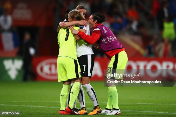 Goalkeeper, Manuela Zinsberger of Austria, Carina Wenninger, Jasmin Pfeiler celebrate the final whistle after the Group C match between France and...