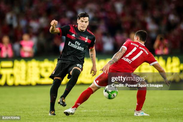 Milan Defender Gustavo Gomez plays against Bayern Munich Midfielder James Rodrguez during the 2017 International Champions Cup China match between FC...