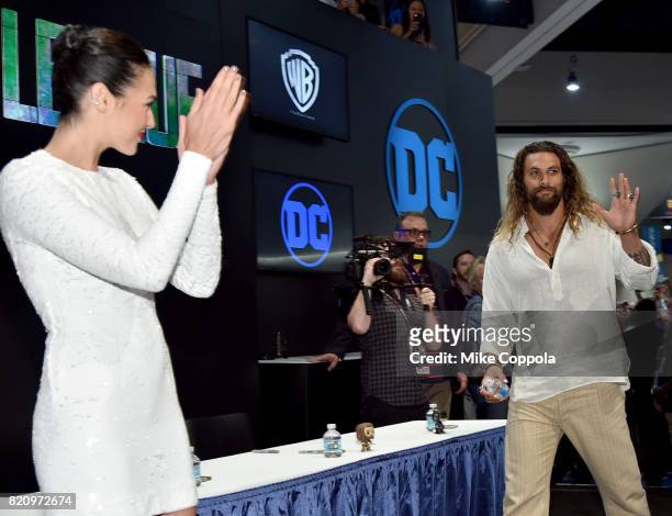 Actor Gal Gadot and Jason Momoa during the "Justice League" autograph signing at Comic-Con International 2017 at San Diego Convention Center on July...
