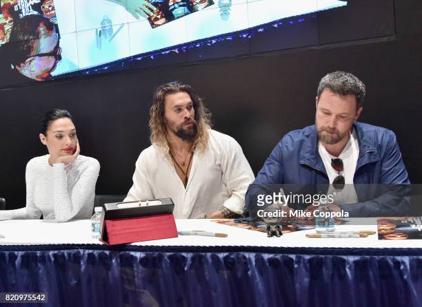 Actors Gal Gadot, Jason Momoa and Ben Affleck during the "Justice League" autograph signing at Comic-Con International 2017 at San Diego Convention...