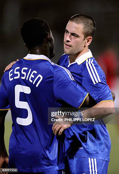Chelsea's Michael Essien congratulates his teammate Joe Cole after he scored a goal during a pre-season friendly match between Chelsea and China's...