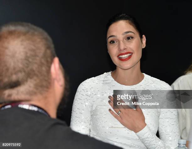 Actor Gal Gadot greets a fan during the "Justice League" autograph signing at Comic-Con International 2017 at San Diego Convention Center on July 22,...
