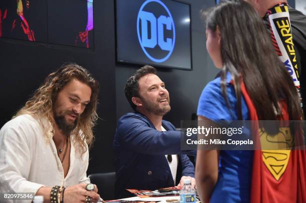 Actors Jason Momoa and Ben Affleck greet fans during the "Justice League" autograph signing at Comic-Con International 2017 at San Diego Convention...