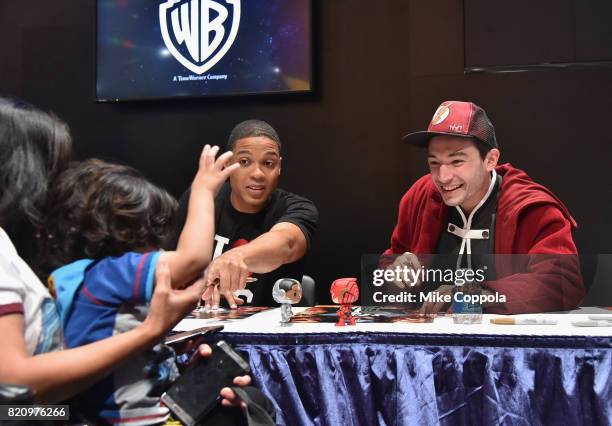 Actors Ray Fisher and Ezra Miller greet fans during the "Justice League" autograph signing at Comic-Con International 2017 at San Diego Convention...