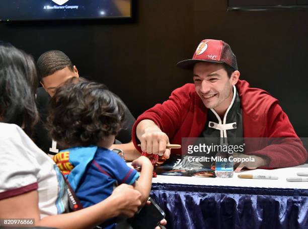 Actors Ray Fisher and Ezra Miller greet fans during the "Justice League" autograph signing at Comic-Con International 2017 at San Diego Convention...