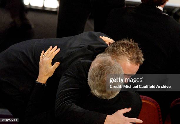 Tim Robbins reacts to winning the Best Supporting Actor Award for "Mystic River" by hugging Clint Eastwood